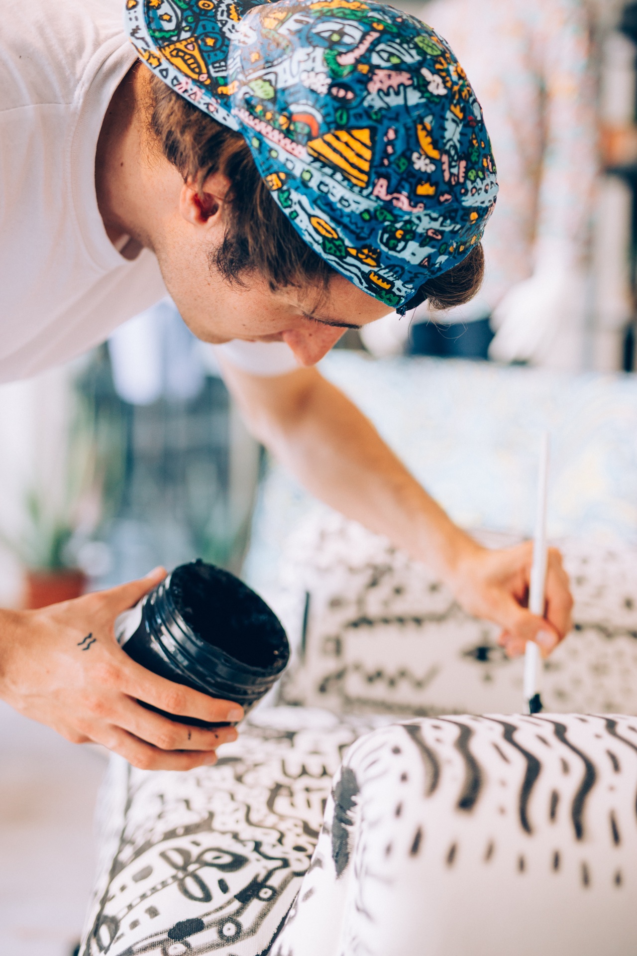Close portrait of Space Raphaël painting furniture