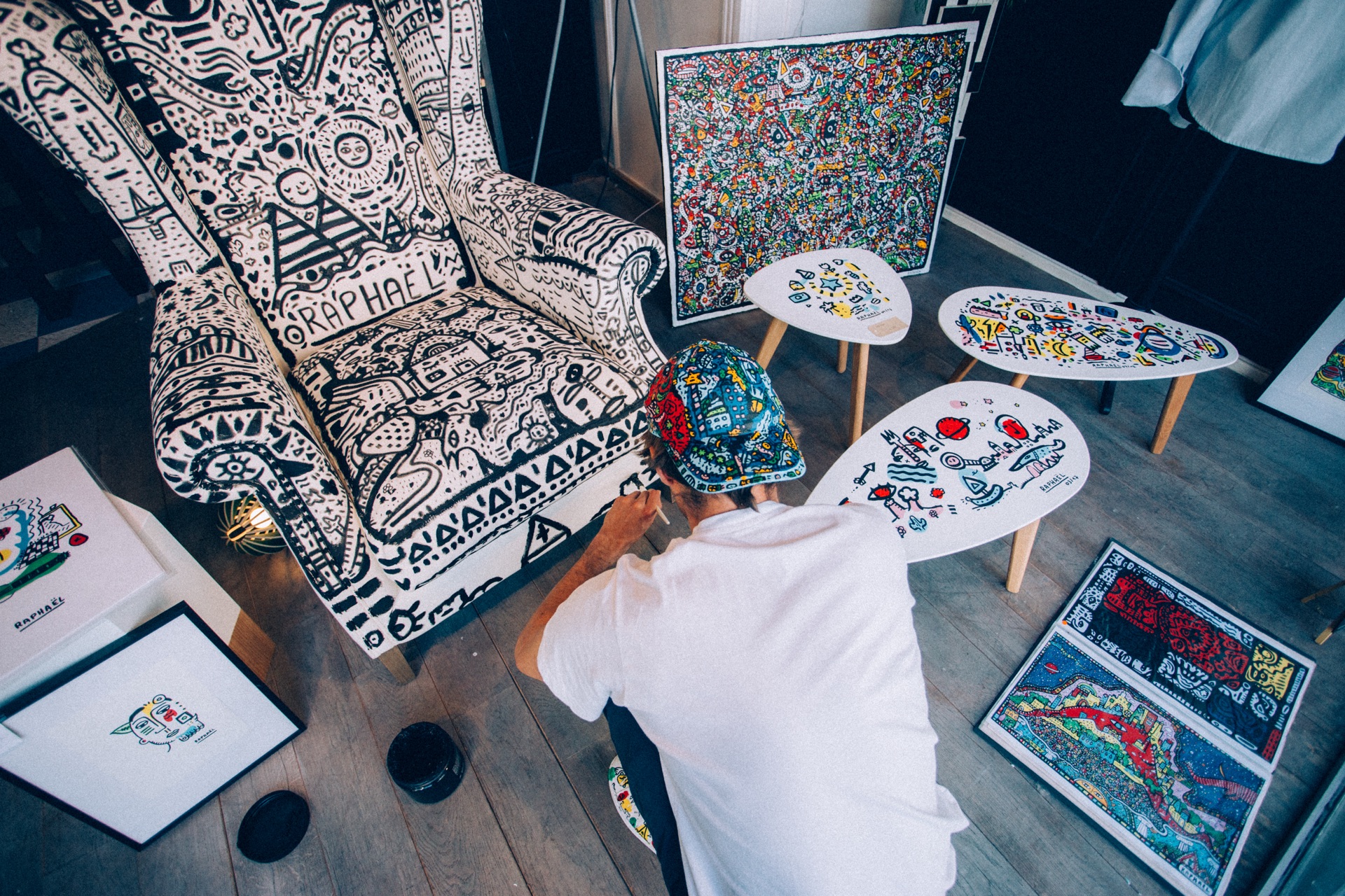 Space Raphaël painting beside finished original artworks