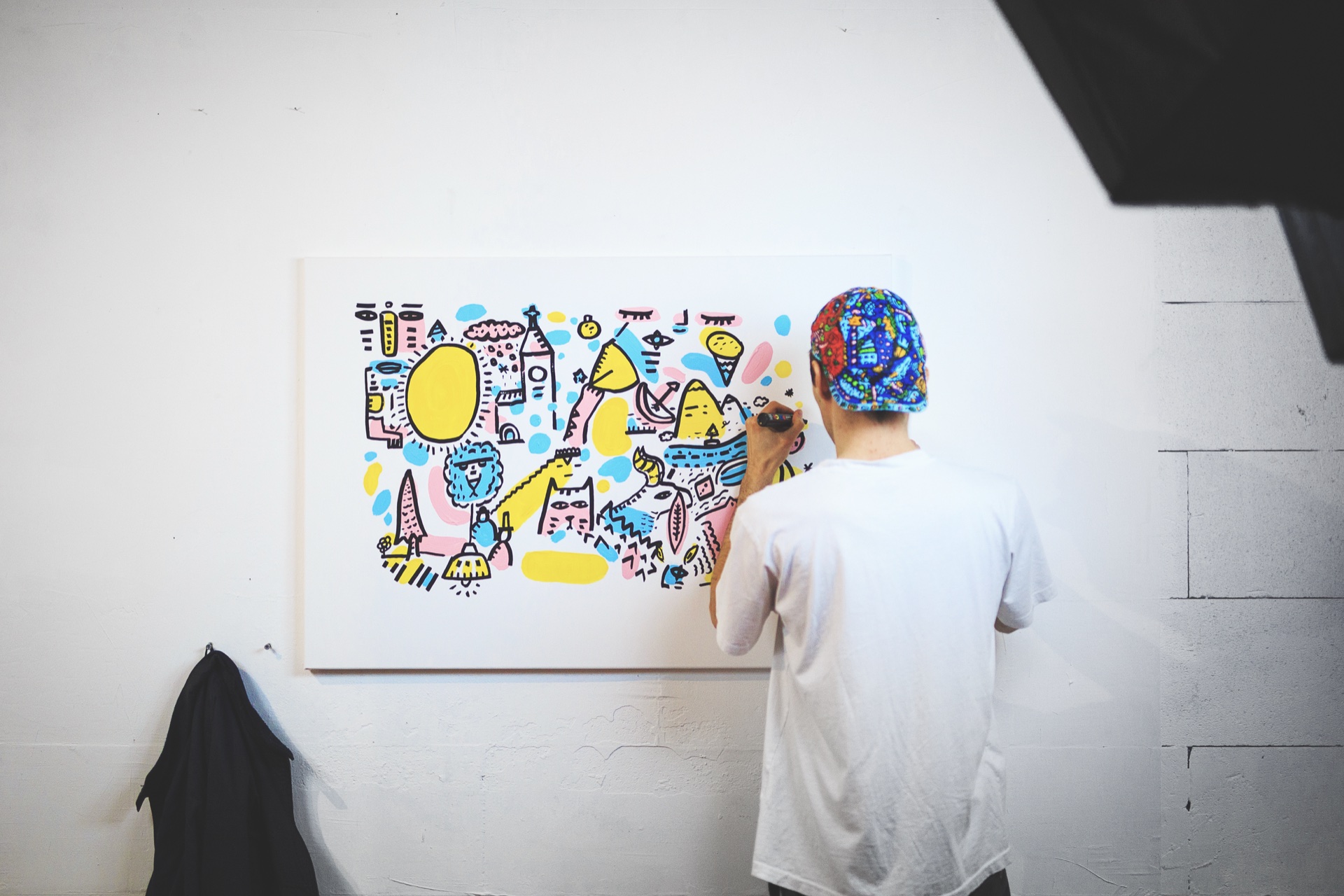 Space Raphaël completing a pastel artwork